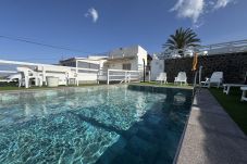 Swimming pool with sea and mountain views